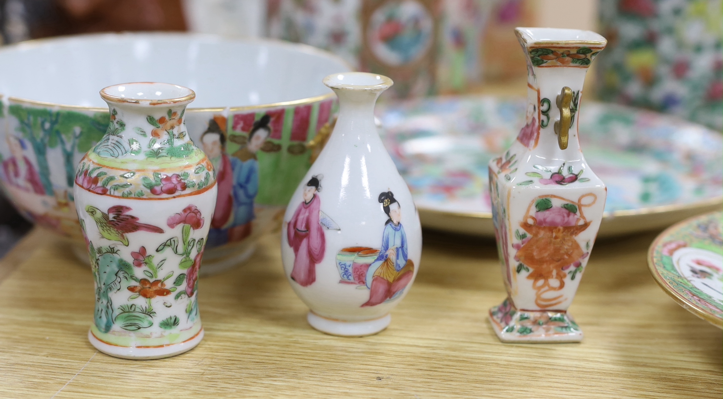 A quantity of 19th century Chinese famille rose dishes, plates, teapots and vases, tallest 21.5cm